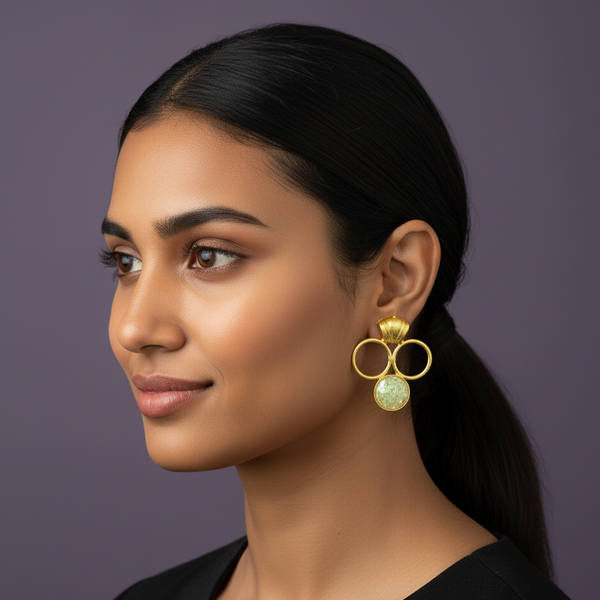 women wearing lumibella's 3 circle statement gold earrings. 