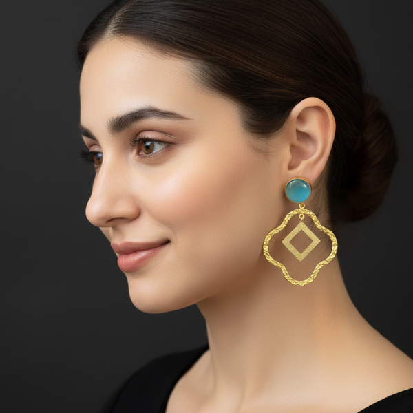 women wearing lumibella's Cyan Party Earrings. 