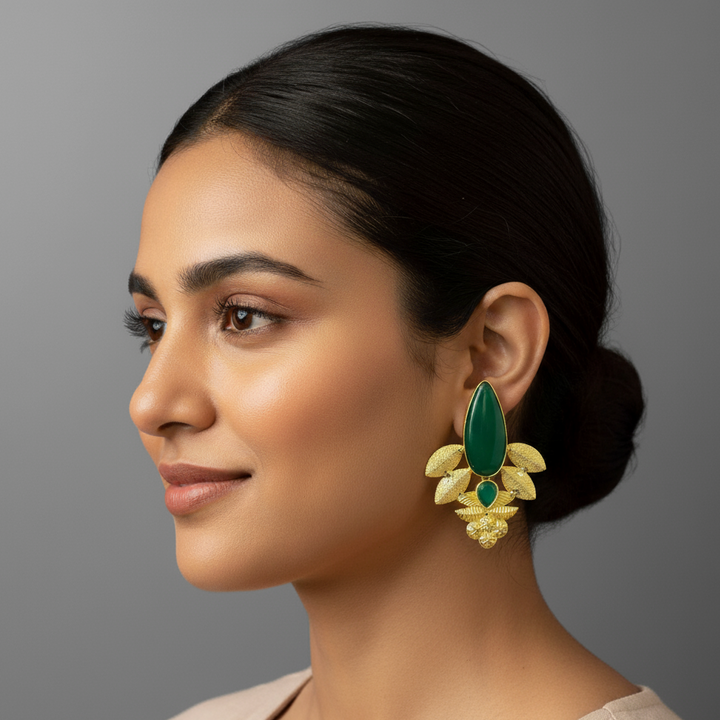 women wearing lumibella's Gold Plated Green Oval Studs. 