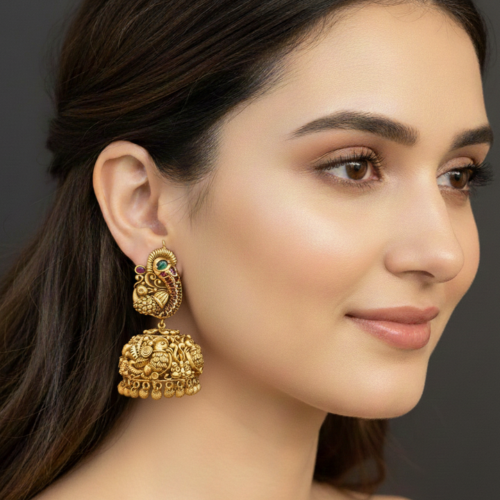 women wearing lumibella's Heavy Temple Peacock Style Large Jhumka Earrings. 