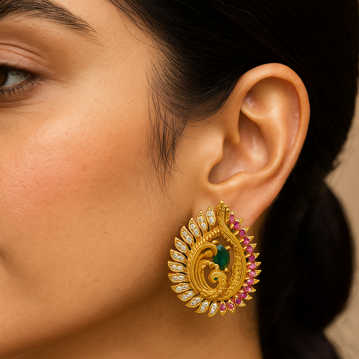 Close-up of a woman wearing a gold earring with gemstones.