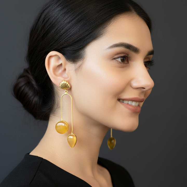 women wearing Lumibella's Orange Pendulum Earrings.