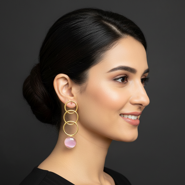 women wearing lumibella's Pastel Pink Circle Party Earrings. 