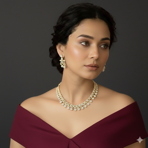 Woman wearing a gold ad necklace and earrings.
