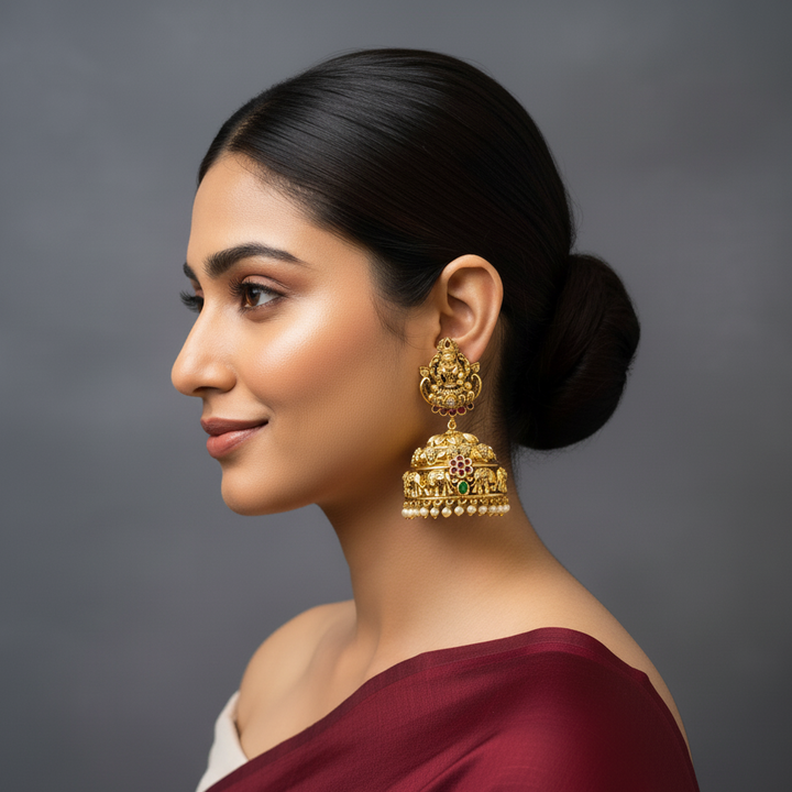 women wearing big temple style jhumka earrings. 