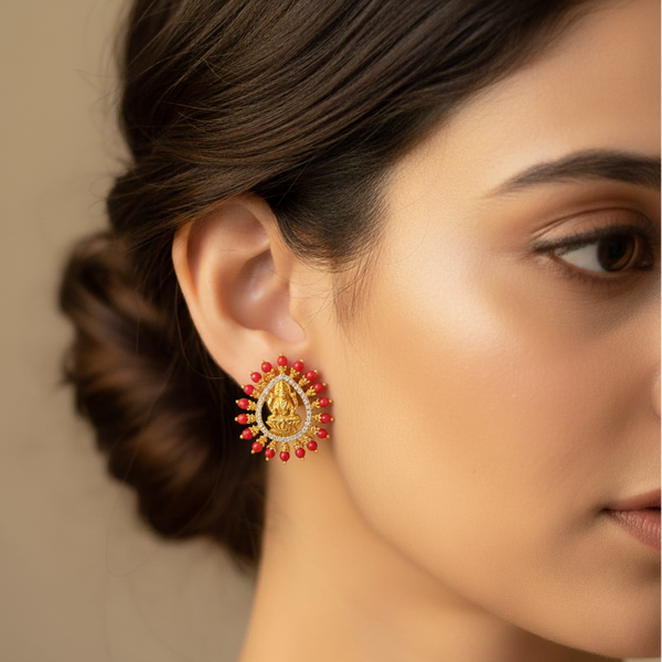 model wearing coral stud earrings 