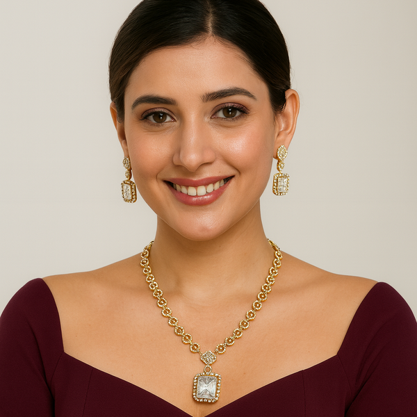 Woman wearing a white ad gold necklace and earrings